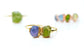 Handcrafted raw gemstone Mother's ring featuring purple and green stones on a gold band, a unique family birthstone heirloom.