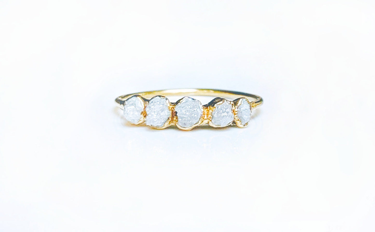 Raw diamond Eternity ring in 18k Gold setting showcasing five conflict-free uncut diamonds.