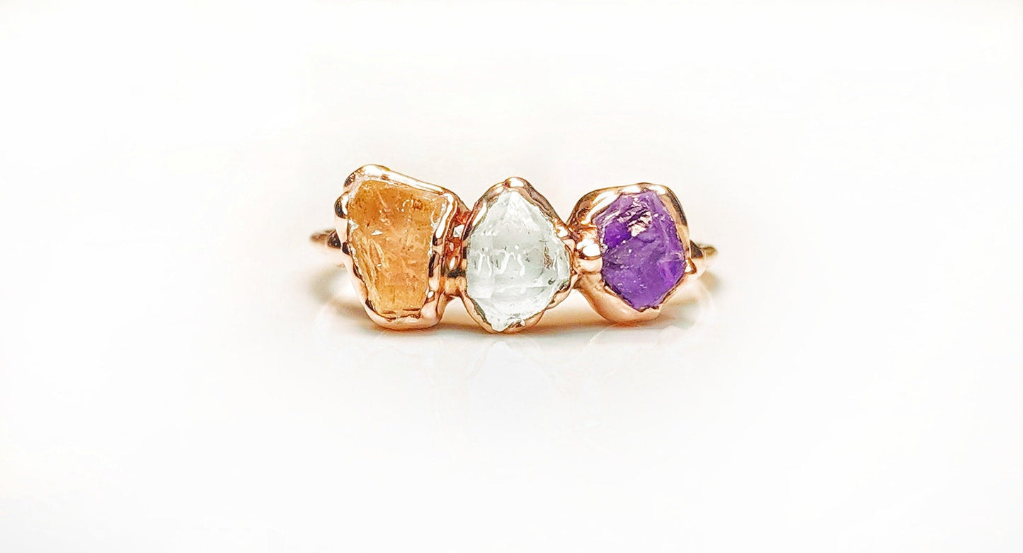 Unique handcrafted raw gemstone Mother's ring featuring citrine, clear quartz, and amethyst stones.