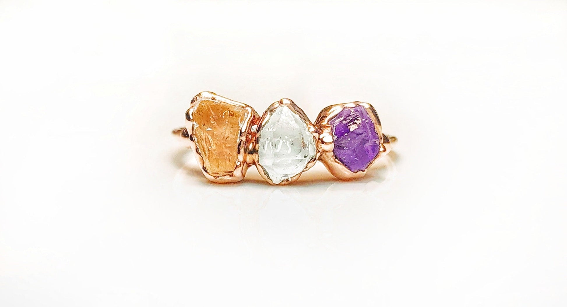 Unique handcrafted raw gemstone Mother's ring featuring citrine, clear quartz, and amethyst stones.
