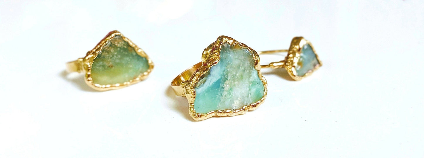 Handcrafted raw Peruvian opal rings with aqua blue stones set in gold-filled bands.