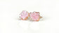 Raw Rose Quartz stud earrings on rose gold posts, promoting self-love and happiness with a soft, gentle energy.