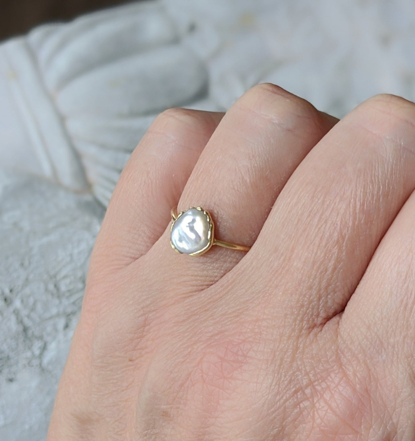 Small Freshwater Keshi pearl ring set on a solid 14k Gold band, highlighting its elegant design and subtle craftsmanship.