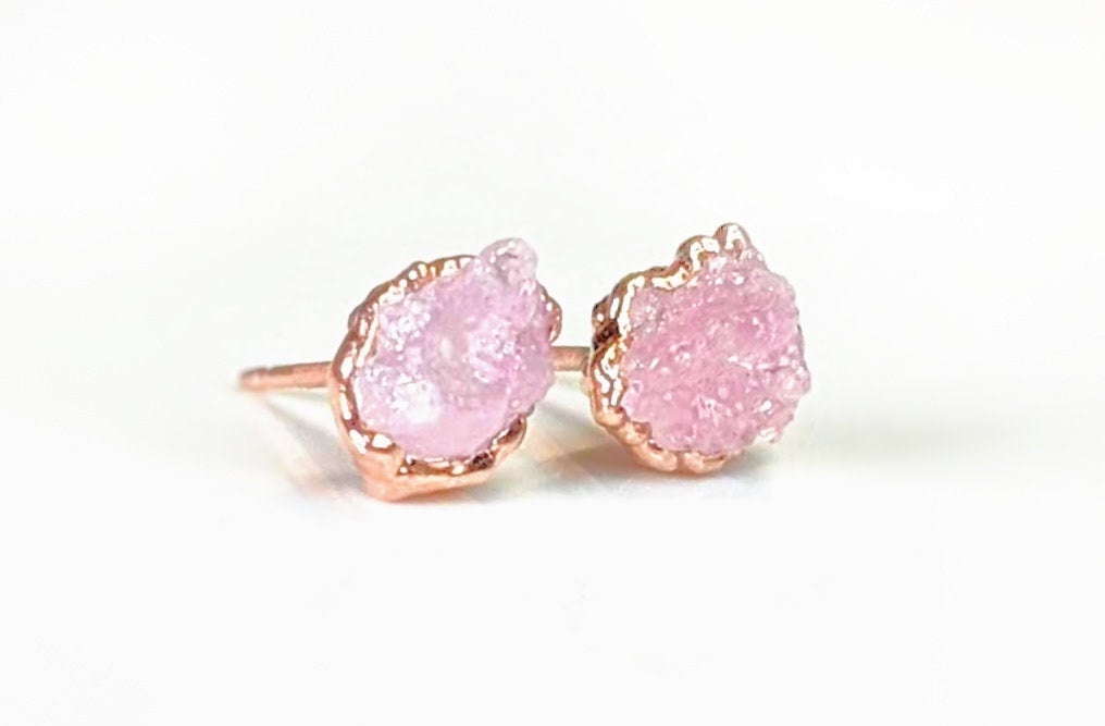 Raw Rose Quartz stud earrings on rose gold posts, embodying self-love and happiness.