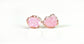 Raw rose quartz stud earrings set in rose gold, promoting self-love and happiness with a gentle energy.