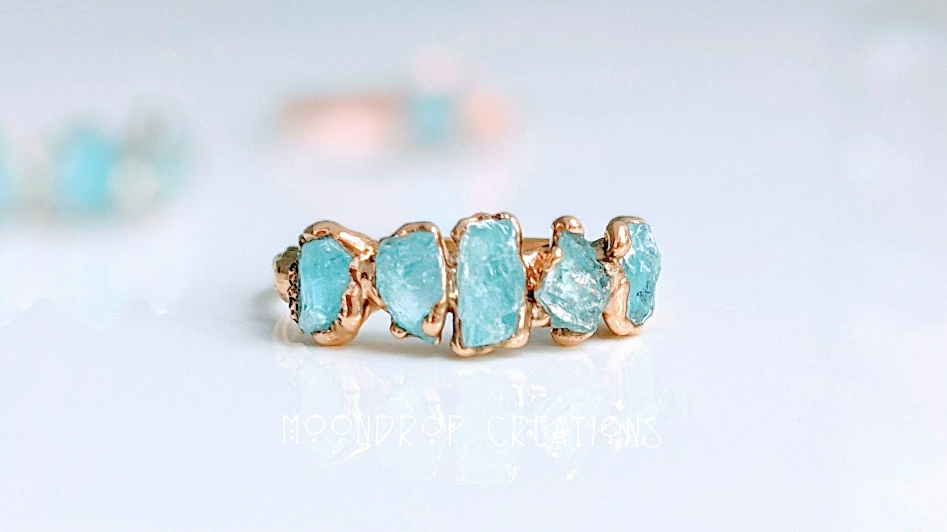 Raw aquamarine ring featuring five natural stones on a 14k gold filled band, perfect for March birthdays.