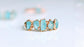 Raw aquamarine ring featuring five natural stones on a 14k gold filled band, perfect for March birthdays.