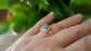 Handcrafted Pink Opal Copper Turquoise ring on a hand, showcasing the unique design and natural gemstones.