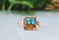 Handcrafted Spiny Oyster copper turquoise ring on a polished surface, showcasing unique gemstone details.