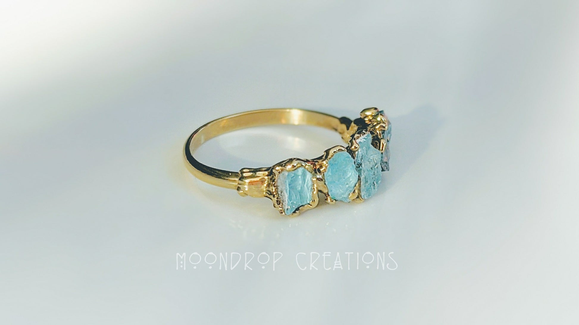 Raw Aquamarine ring with 14k Gold filled band, featuring five natural raw Aquamarine stones for March birthstone.