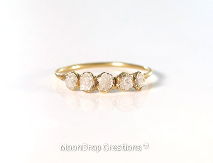 Raw diamond eternity ring in 18k gold, featuring five uncut conflict-free diamonds.