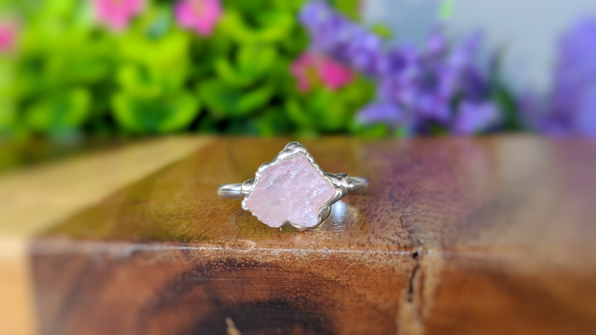 Delicate raw pink Morganite ring set on a handcrafted Sterling Silver band, showcasing a unique electroformed design.