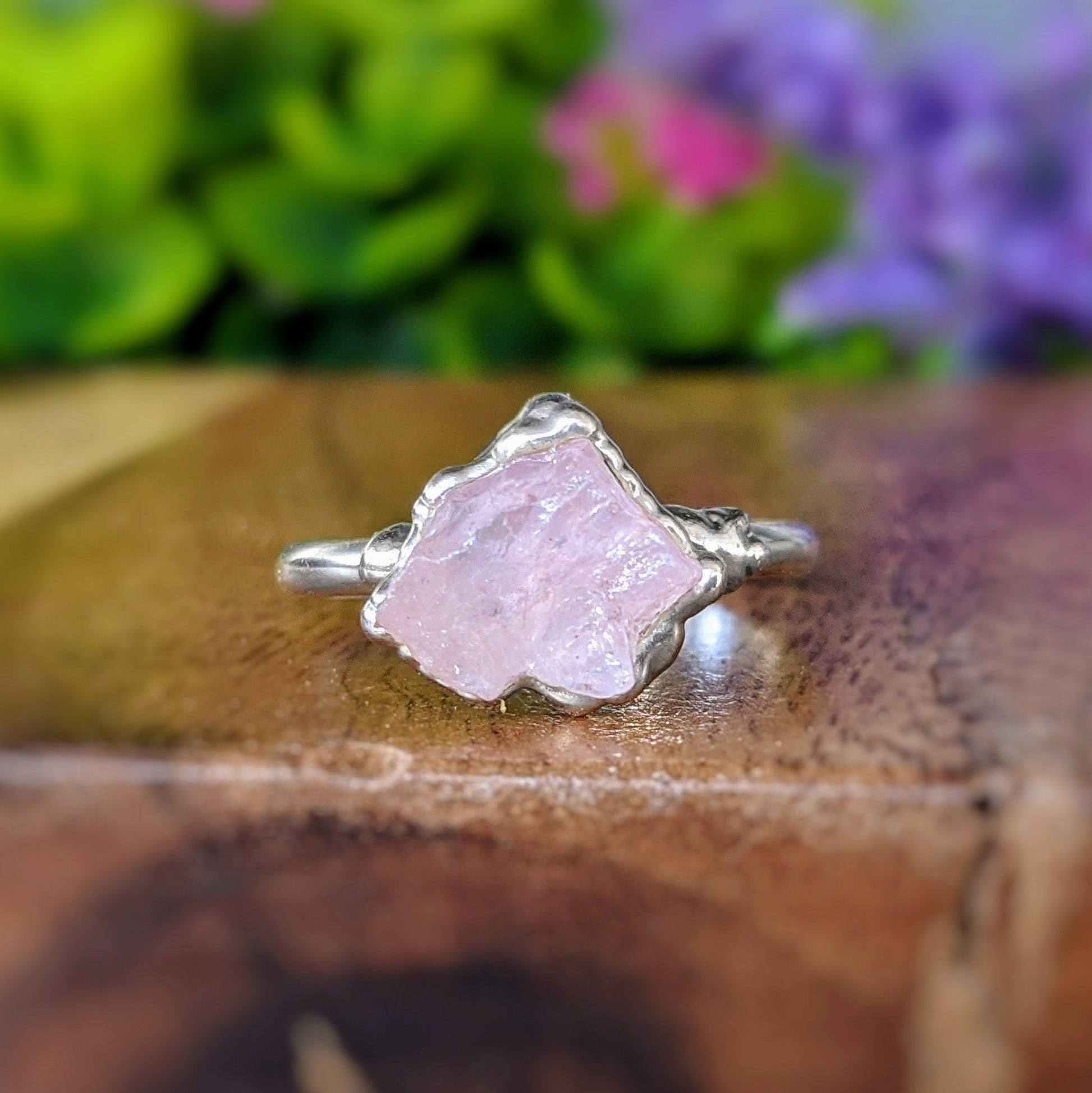 Handcrafted raw pink Morganite ring on a Sterling Silver band, showcasing its unique rustic charm.