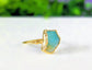 Handcrafted raw Peruvian opal ring in aqua blue set on a 14k gold filled band.