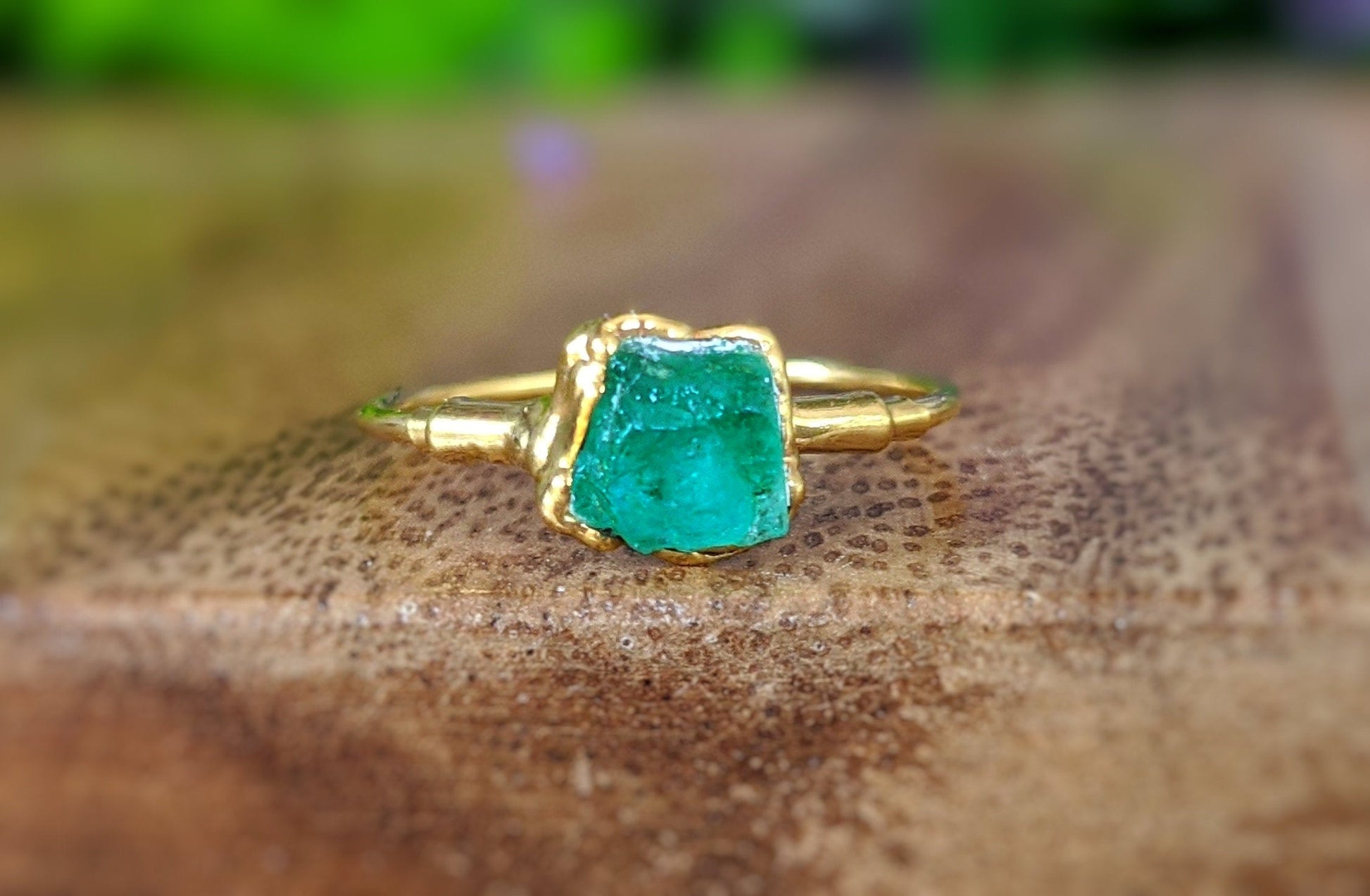 Handcrafted raw Emerald ring on a 14k Gold filled band, showcasing May's birthstone in a unique design.
