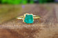 Handcrafted raw Emerald ring on a 14k Gold filled band, showcasing May's birthstone in a unique design.