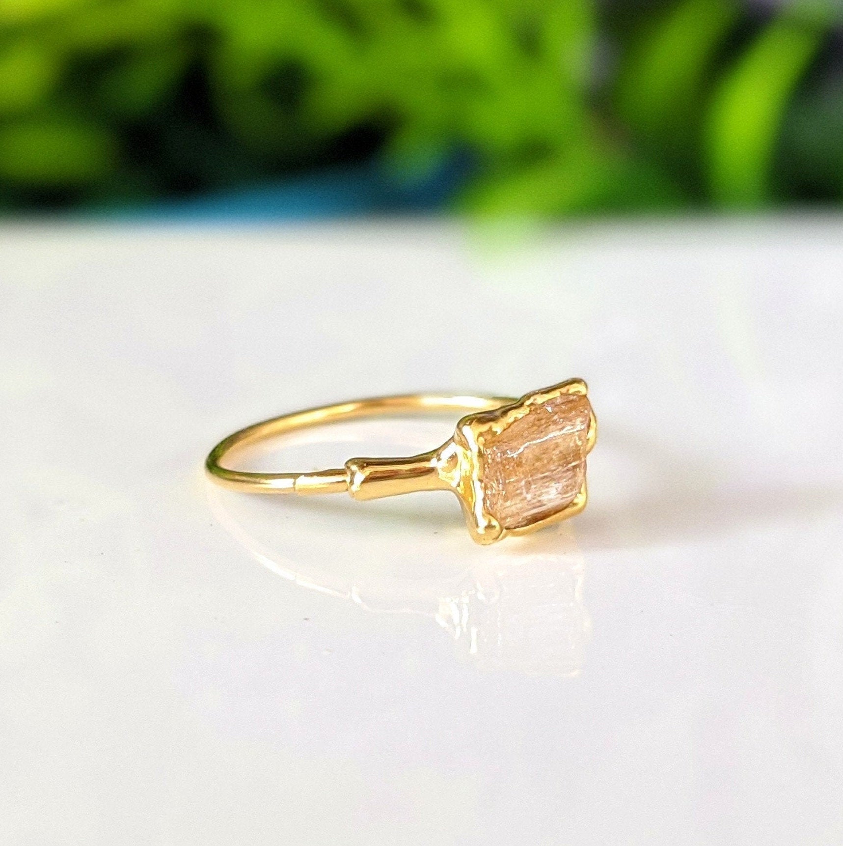 Handmade raw Imperial Topaz ring on 18k gold band, featuring a honey-colored gemstone, perfect for November birthdays.