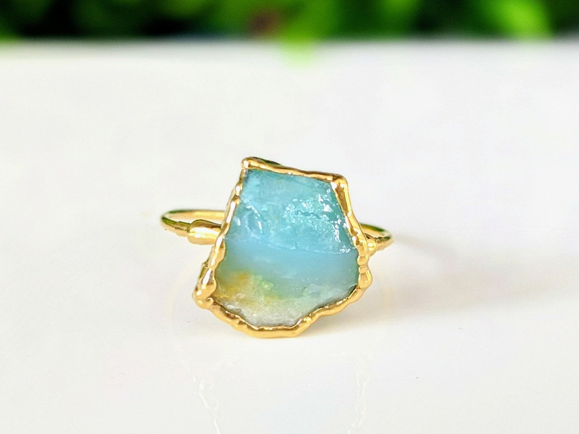 Handcrafted raw Peruvian opal ring on a 14k gold filled band with aqua blue gemstone.