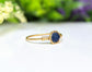 Raw blue Sapphire ring set in gold, showcasing its unique natural form and elegant design, perfect for special occasions.