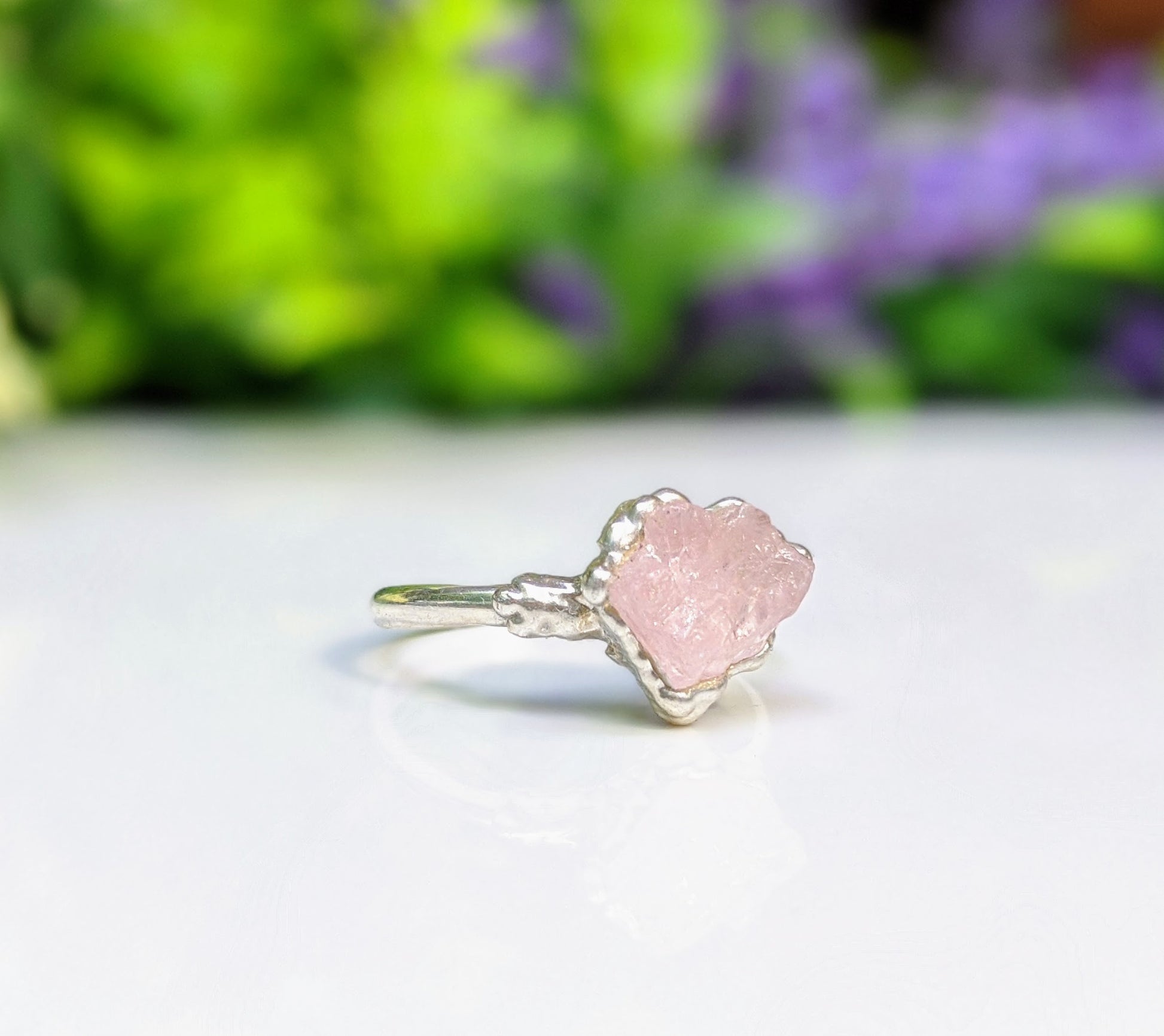 Handcrafted raw pink Morganite ring set on a delicate Sterling Silver band, showcasing a rustic charm.