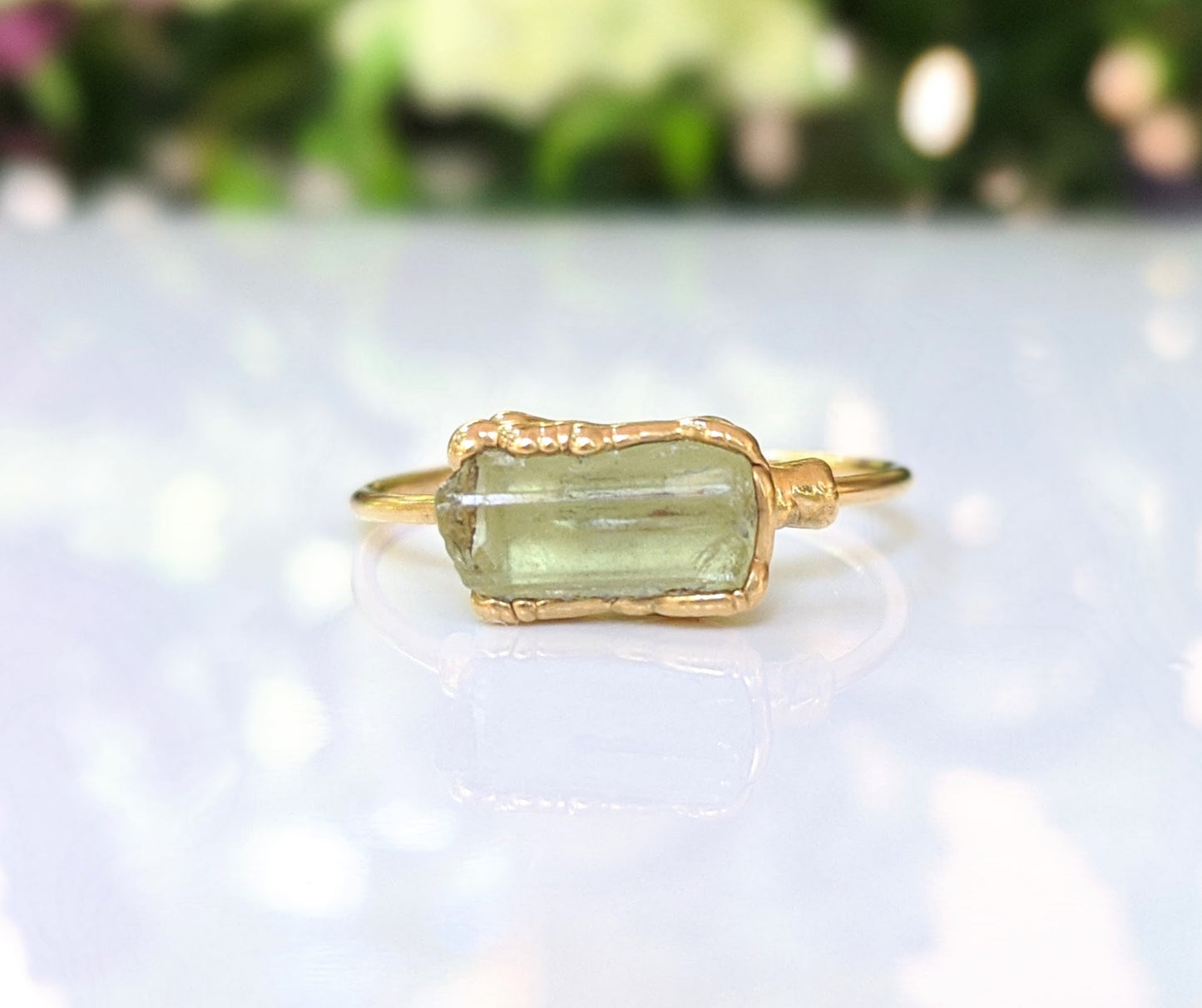 Raw yellow Apatite ring with a gold filled band, showcasing a unique natural stone design.