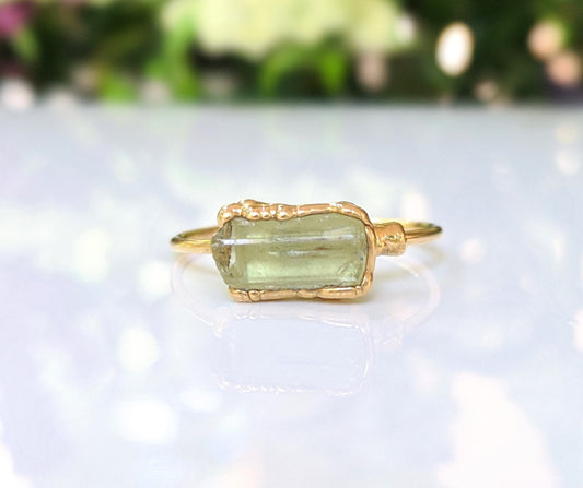 Raw yellow Apatite ring with a gold filled band, showcasing a unique natural stone design.