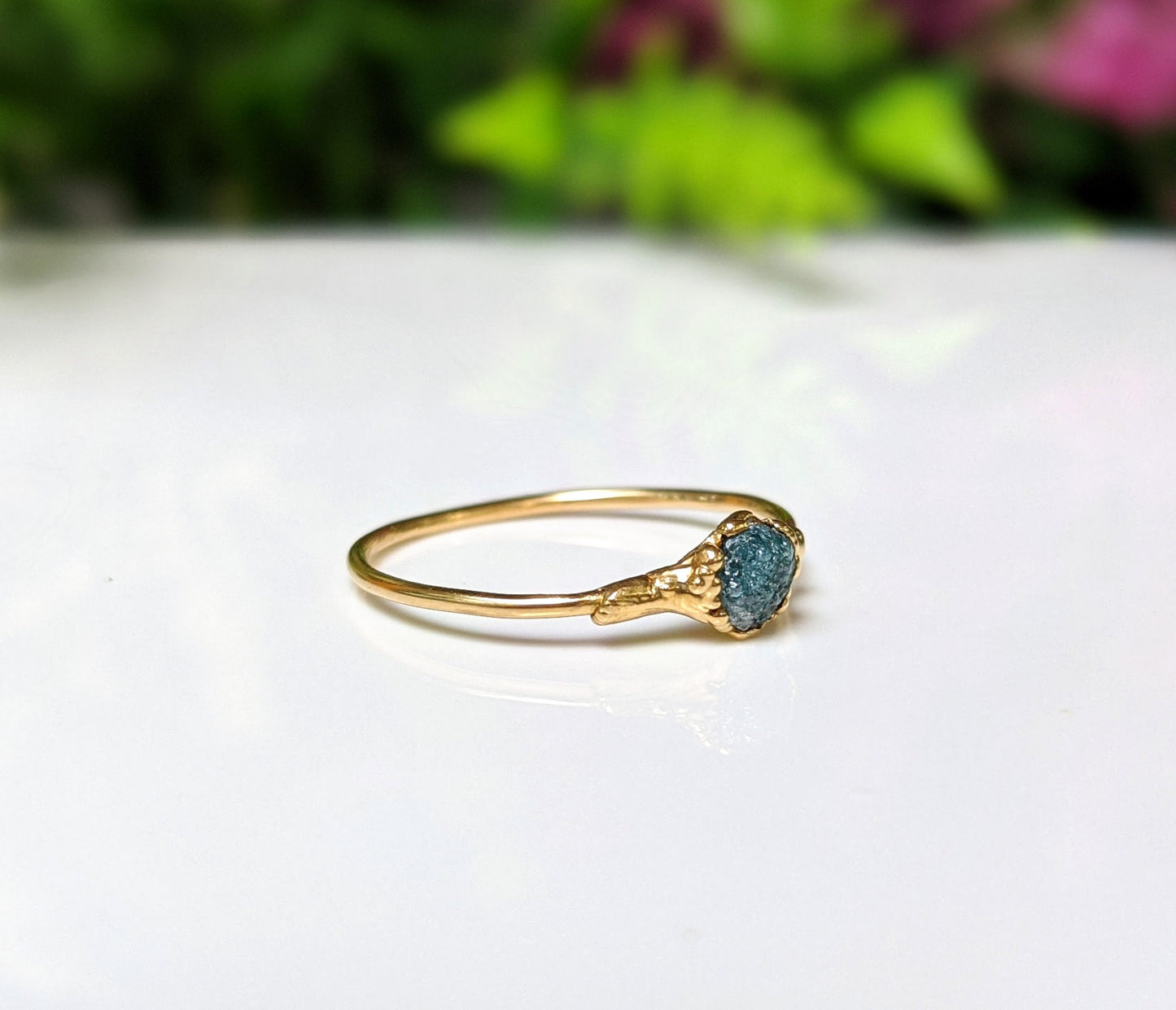 Handcrafted raw blue diamond engagement ring set on a solid 18k gold band, perfect for Valentine's Day.