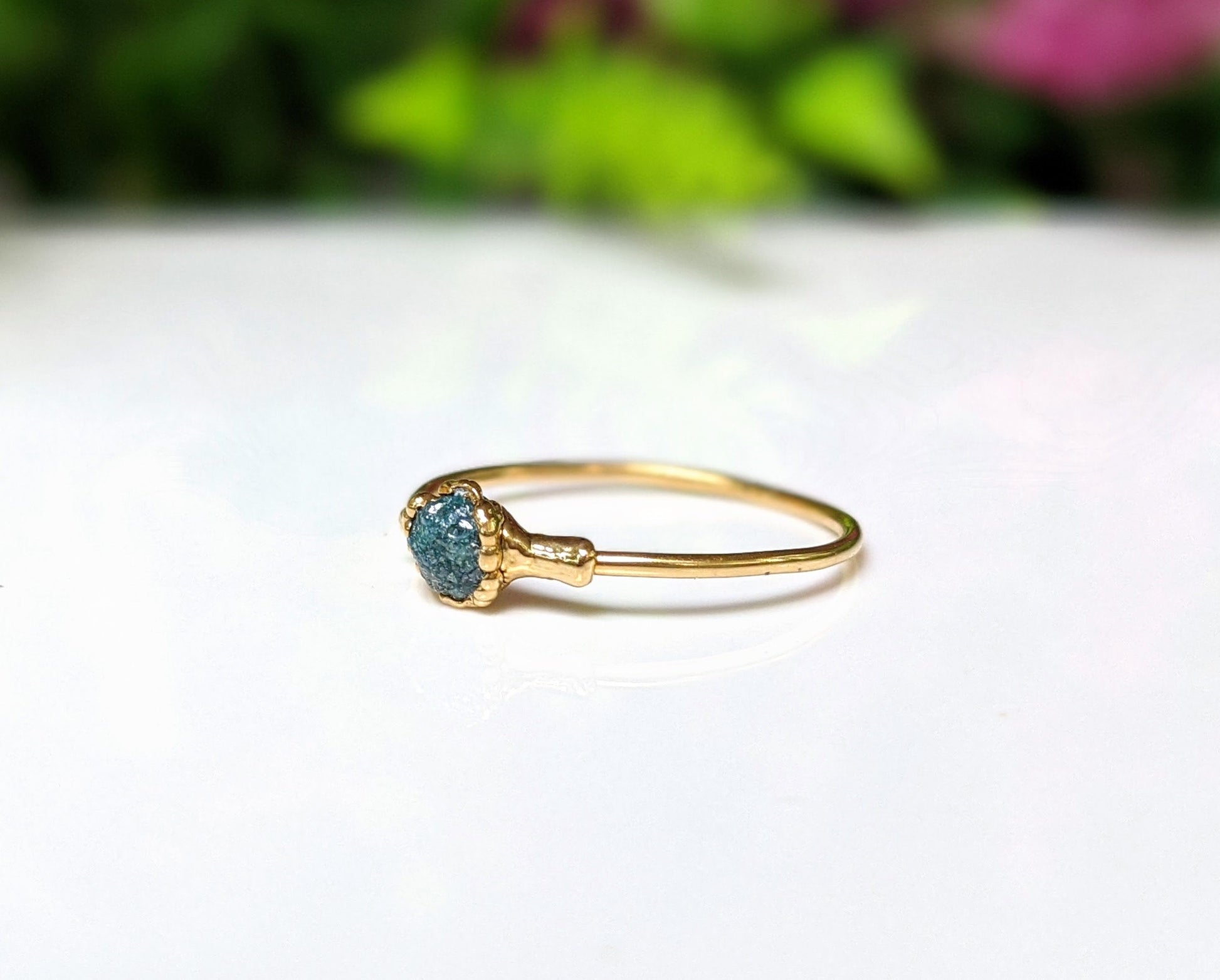 Handcrafted raw blue diamond engagement ring on a solid 18k gold band, perfect for Valentine's Day.