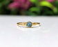 Raw blue diamond engagement ring on an 18k gold band, handcrafted and unique for special occasions.