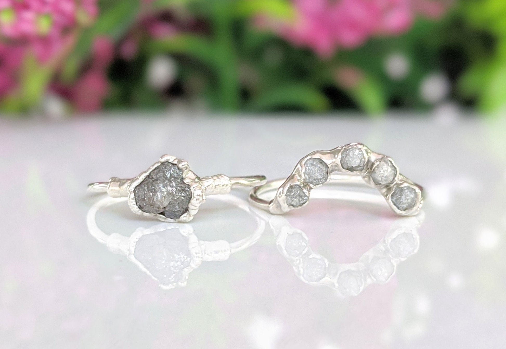 Raw diamond Chevron wedding ring set featuring uncut silver-grey diamonds on polished silver bands.