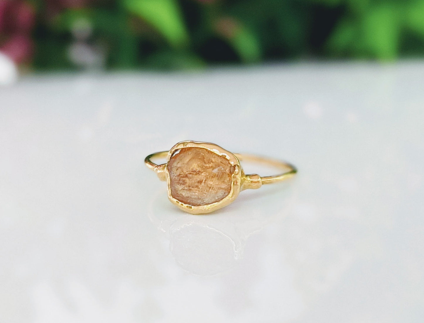 Raw Hessonite Garnet ring on 14k Gold filled band, showcasing warm golden hues and natural texture.