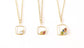 Family birthstone necklaces with square gold pendants and various raw gemstones, perfect for mothers.