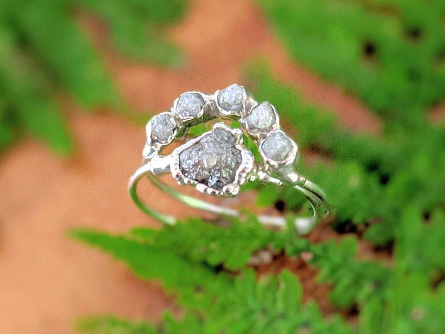 Raw diamond Chevron wedding ring set featuring unique silver-grey diamonds on a Sterling silver band, handcrafted elegance.