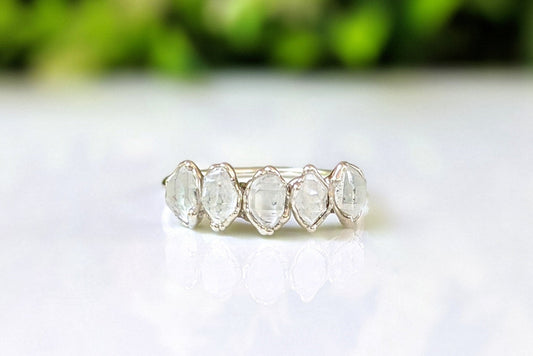 Handcrafted Silver eternity ring with five raw Herkimer diamonds, set elegantly on a shiny Sterling Silver band.