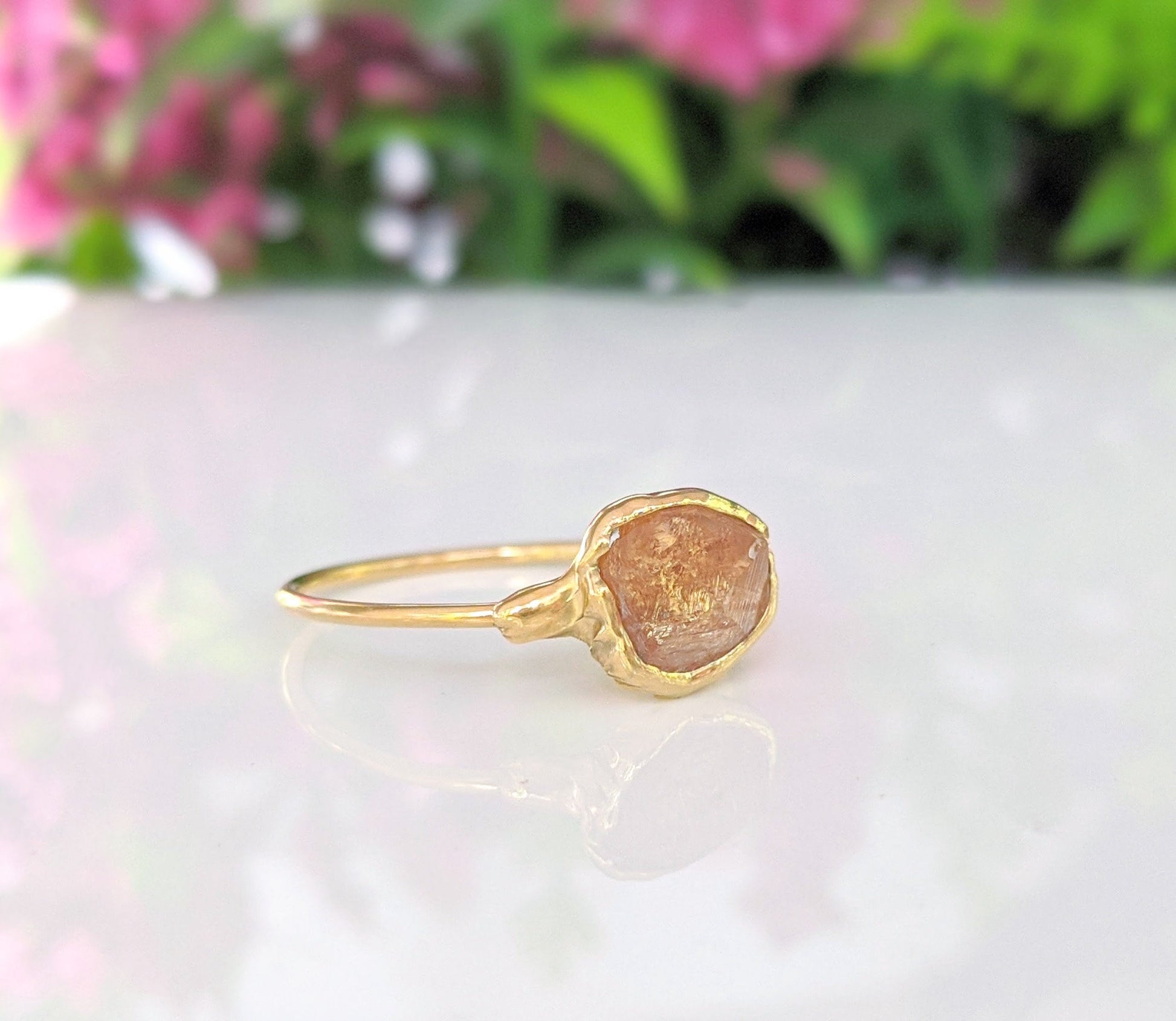 Raw Hessonite Garnet ring on 14k Gold filled band, showing its unique golden hue and natural texture.