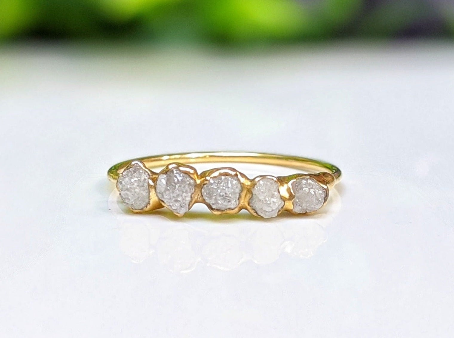 Handcrafted raw diamond eternity ring in 18k gold, featuring five conflict-free uncut diamonds, symbolizing everlasting love.