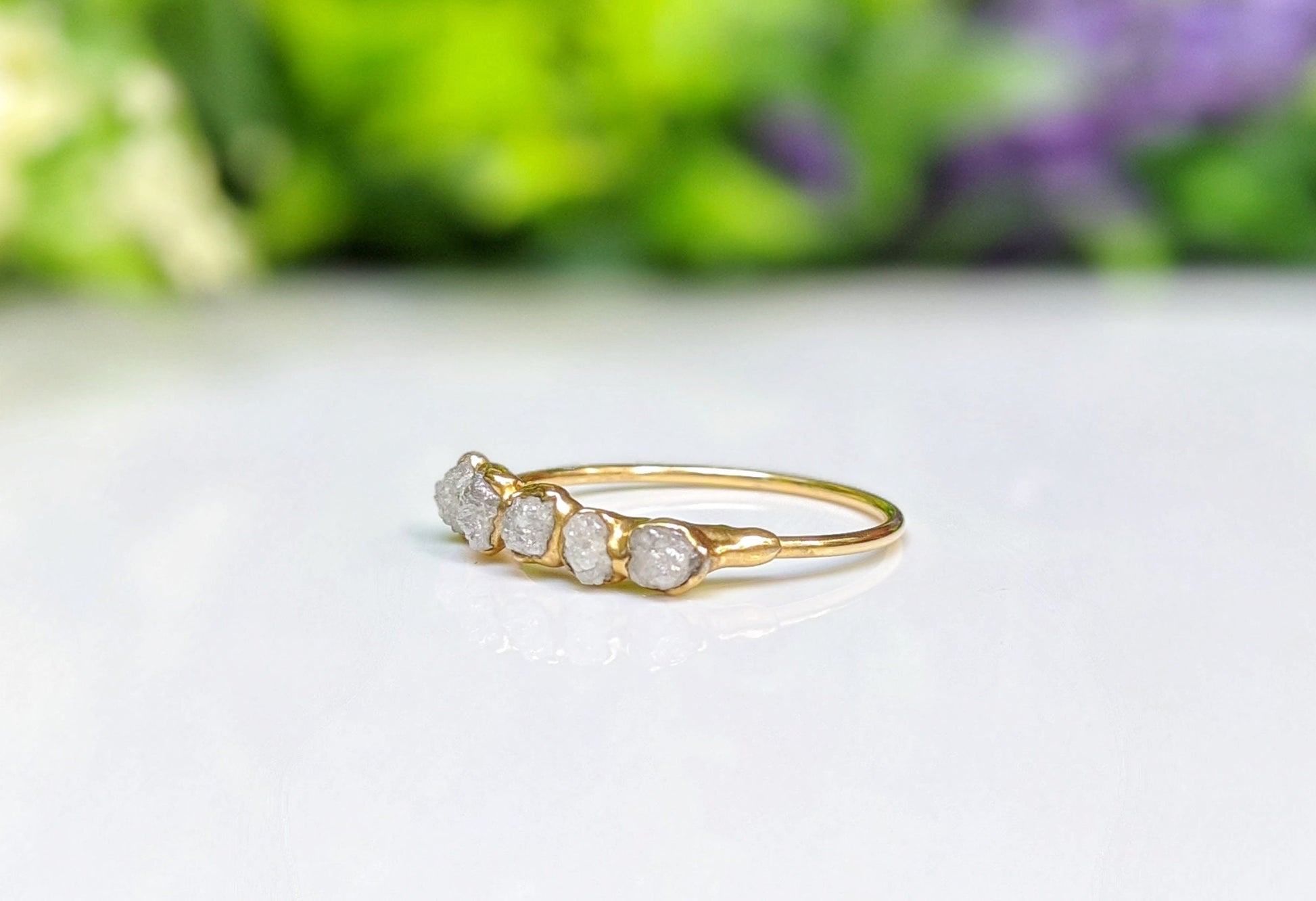 Handcrafted raw diamond eternity ring in 18k gold setting, featuring five conflict-free uncut diamonds, symbolizing everlasting love.