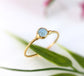 Dainty aquamarine stacking ring with a natural 4mm stone set on a gold filled band, perfect for everyday wear.