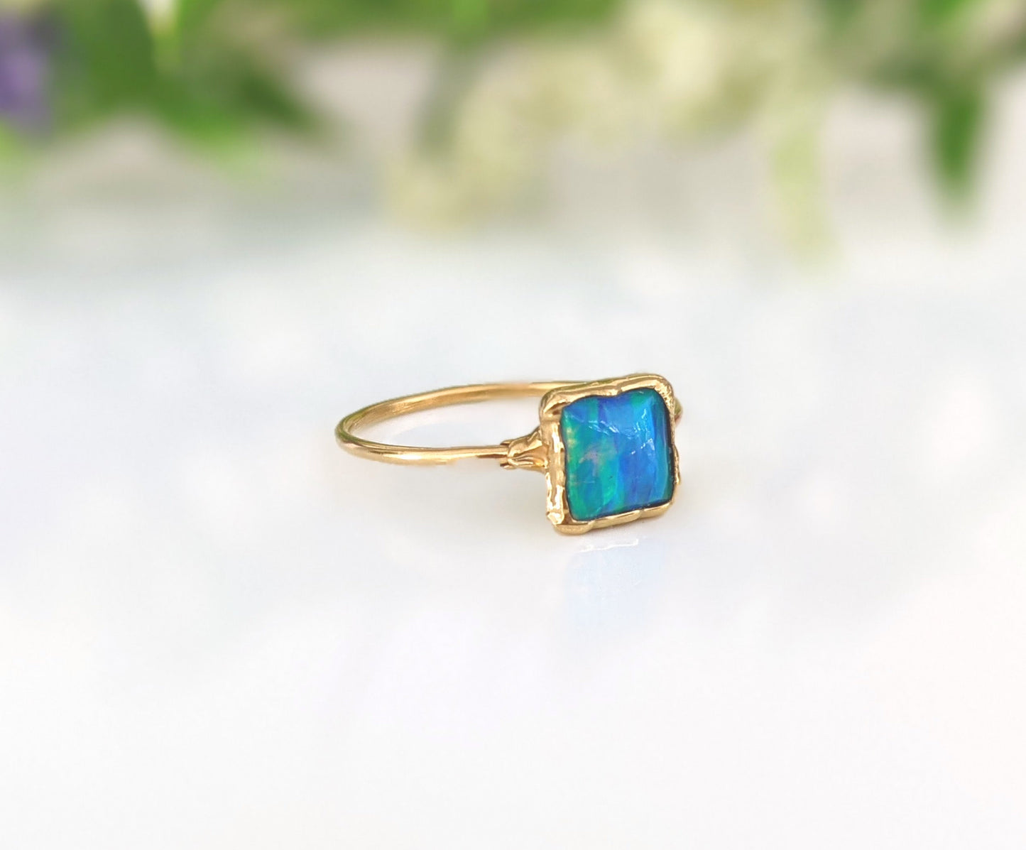 Aqua blue square opal ring set in 18k gold, showcasing a beautiful opal stone on 14k gold filled band.