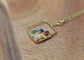 Gold-filled family birthstone necklace with colorful raw gemstones on a wooden surface.