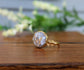 Stunning 18k gold-plated ring featuring a natural white crystal copper stone on a gold-filled band.