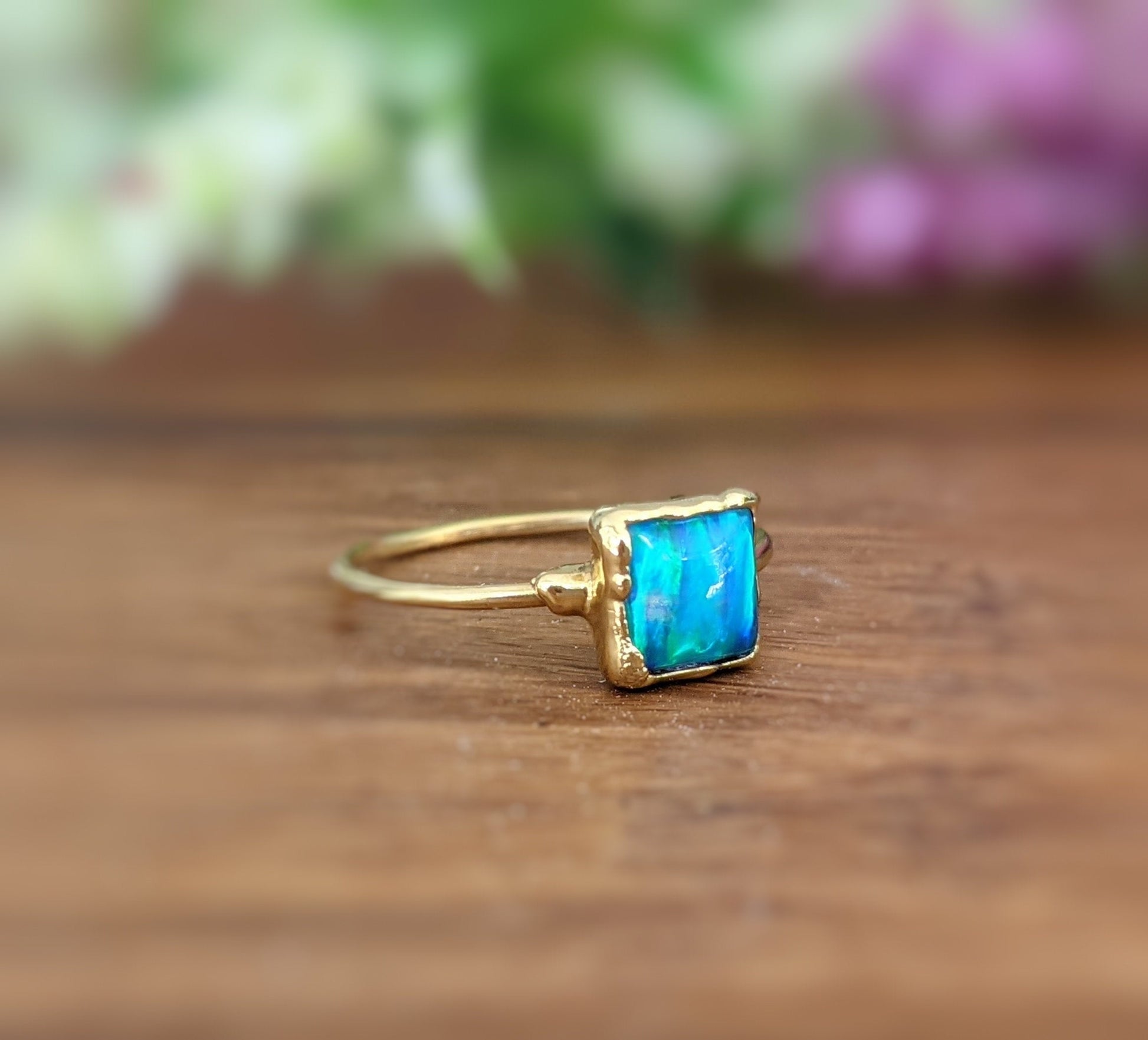 Stunning blue Opal ring in 18k gold, featuring a square aqua blue opal on a gold-filled band.
