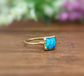 Stunning blue Opal ring in 18k gold, featuring a square aqua blue opal on a gold-filled band.