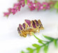 Raw Rhodolite Garnet eternity ring with gold filled 14k band and unique gemstone design.
