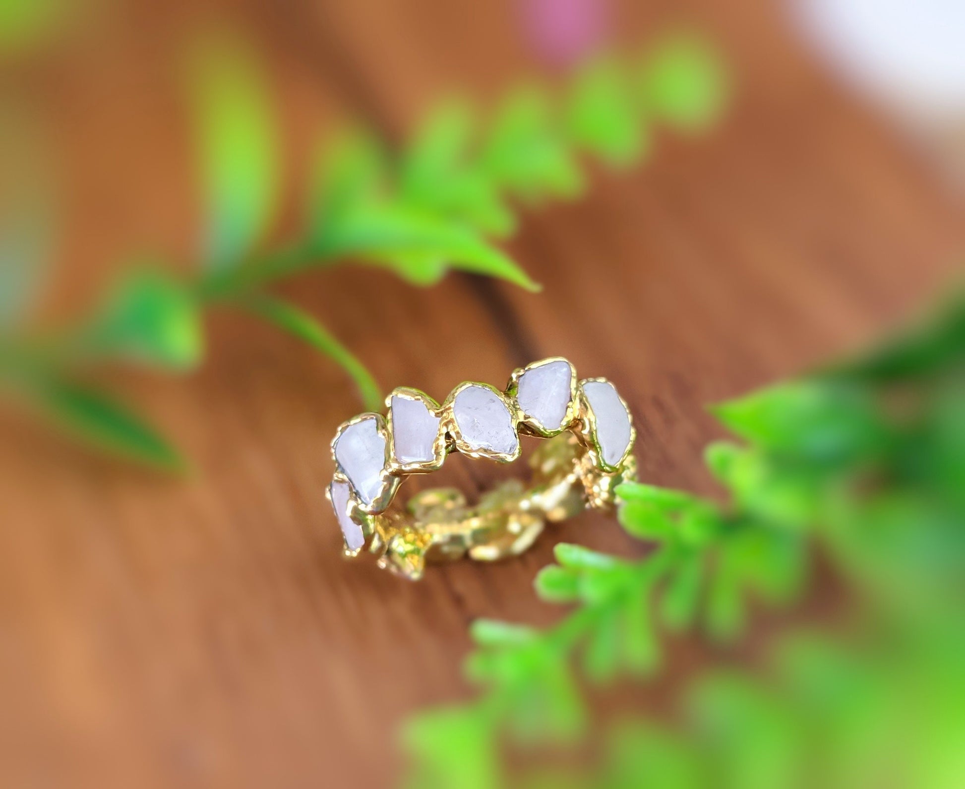 Rose Quartz eternity gold ring featuring unique shapes and gemstones, set on a 14k gold filled band.