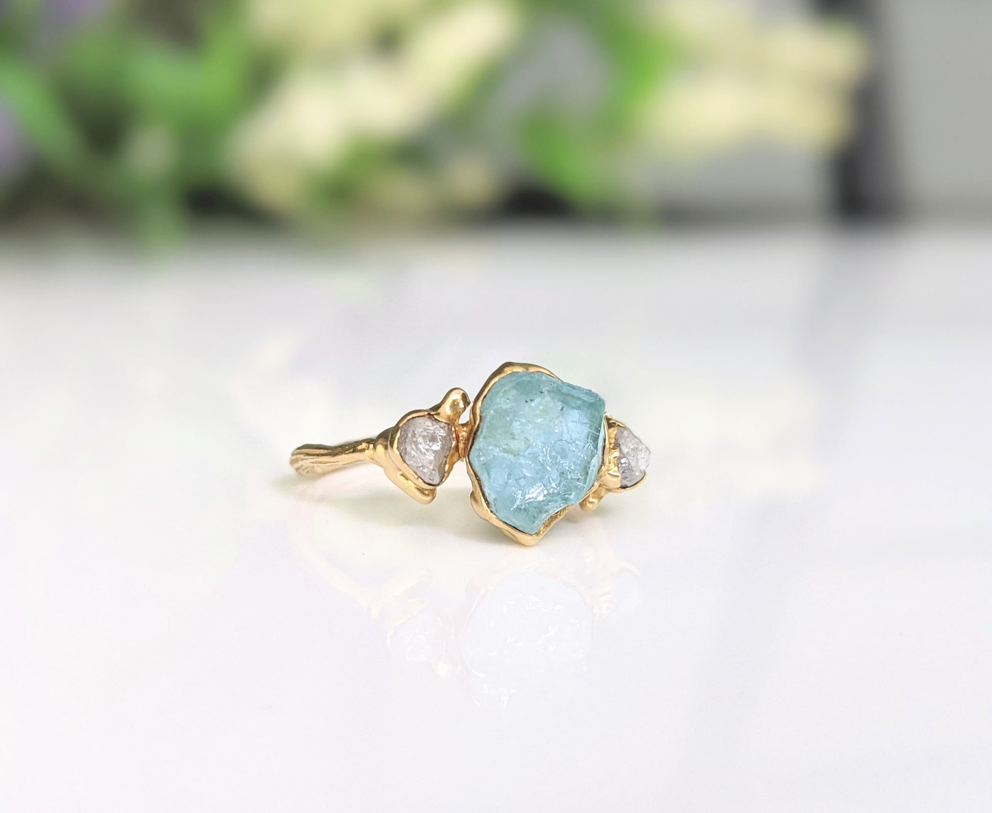 Raw Aquamarine and diamond twig ring in gold with nature-inspired design, perfect for unique engagement or promise rings.