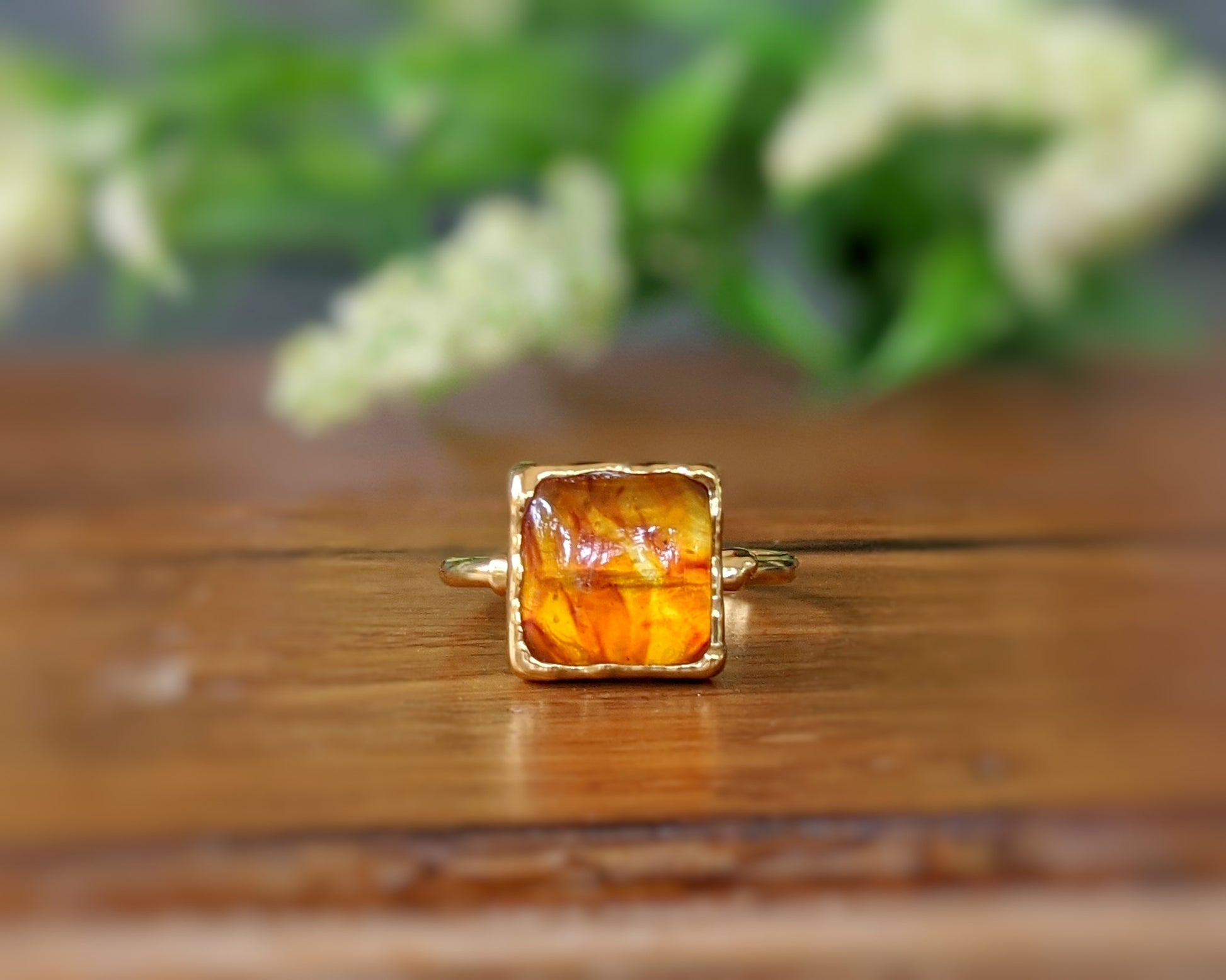 Honey-colored square Baltic Amber ring on a 14k gold filled band, featuring unique natural stone details.