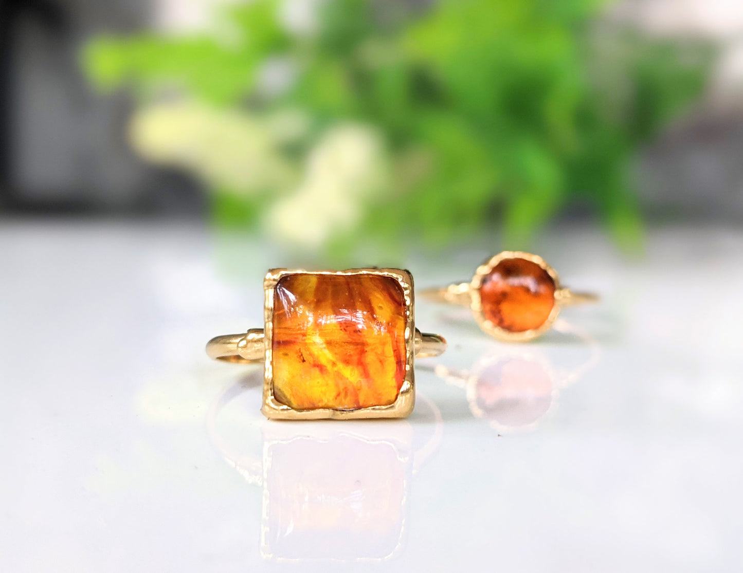 Baltic Amber gold ring showcasing a honey-colored square amber stone on a gold-filled band, handcrafted and unique.