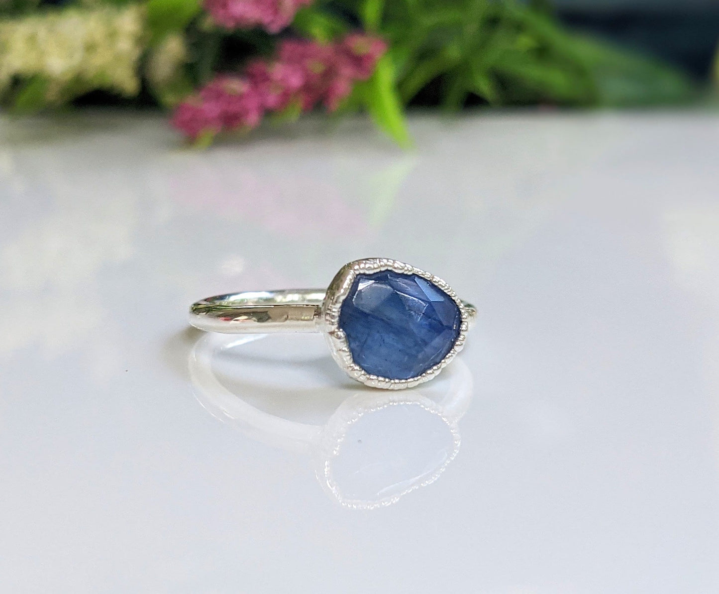 Rustic blue Kyanite ring on a sterling silver band, showcasing unique elegance and natural beauty.