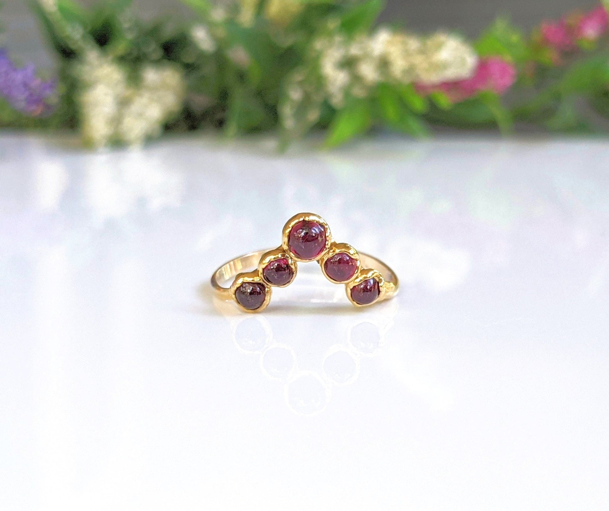 Ruby chevron ring in 18k gold with five natural rubies, perfect for anniversaries and as a special gift.